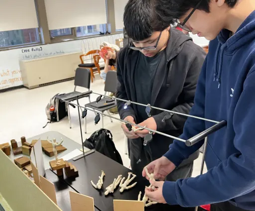 students manipulate wooden forms