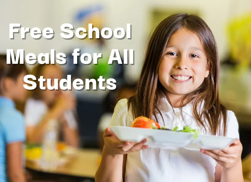 A smiling child holds up a school lunch. White text says Free School Meals for All Students